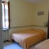 Albergo Michieletto in Montano Lucino, simple twin room with open window and two single beds