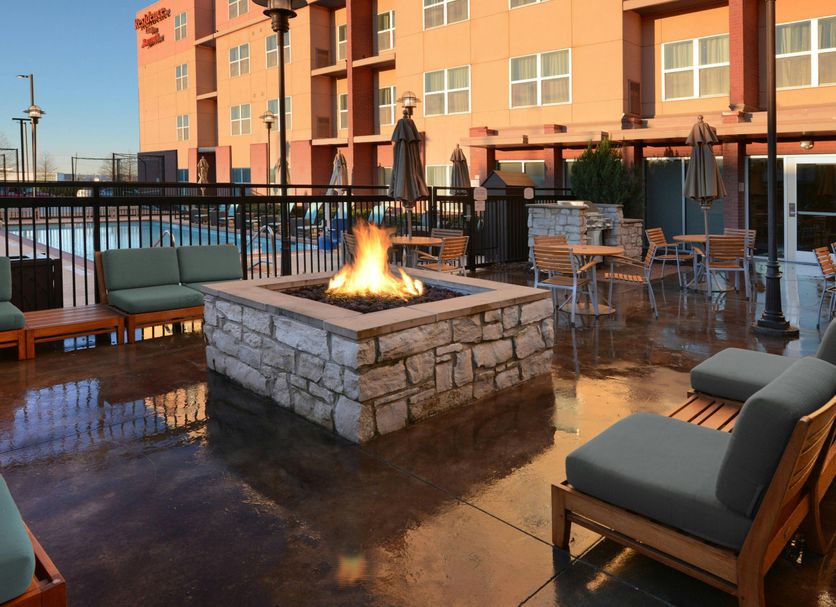 Residence Inn by Marriott Dallas Plano/The Colony fire pit patio with seating and outdoor pool view