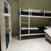 Svea Hostel Stockholm room with bunk beds, single bed, and tiled floor