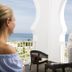 Concorde Green Park Palace in Port El-Kantaoui balcony view of the sea with guests on a terrace