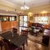 Downtowner Inn and Suites lobby in Houston with seating area, front desk, and dining table