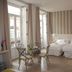 Hotel San Lorenzo Boutique in Valencia: bright guest room with twin beds, balcony doors and seating area
