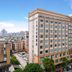 Kyriad Hotel Guangzhou Panyu Aoyuan Plaza in Guangzhou, a multi-story city hotel building