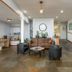 Alsi Resort lobby in Waldport with seating area, front desk, and staircase