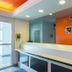 Motel 6-San Antonio, Tx - Sea World North lobby front desk in San Antonio with orange accent wall