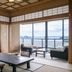 Hotel Biwanso in Nanao, tatami room with tables and sea-view balcony