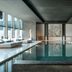 La Réserve Resort in Knokke Heist indoor pool with loungers and floor-to-ceiling windows
