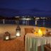 Copamarina Beach Resort & Spa in Guánica: beachside candlelit dinner setup with ocean view at night