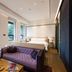 Guanyin Yiyuntai Hotel Chengdu guest room with sofa, bed and large windows in Chengdu