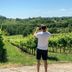 Relais Le Betulle in Conegliano with vineyard views and a guest overlooking the green hills