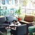 Casavilla Travellers Lodge Pudu in Kuala Lumpur lounge with sofas, chairs and potted plants on a balcony