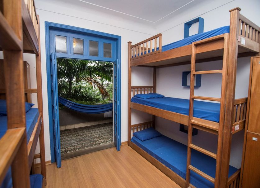 Ipanema Beach House in Rio de Janeiro room with bunk beds and a hammock on the patio