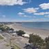 Rayentray Grand Hotel in Puerto Madryn overlooking a wide sandy beach and calm blue ocean
