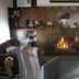 The Highlander Motel, Maryborough: cozy lounge with fireplace and armchairs