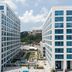Sheraton Lincoln Harbor Hotel in Weehawken with twin modern towers framing a courtyard and pool