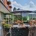 Pension Haus Diefenbach in Heimbach with terrace seating, umbrellas and mountain views