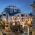 Mercure Chisinau Center Jazz Hotel in Chisinau at dusk, with illuminated modern facade and city street below