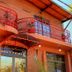 Hosteria Maryland in Posadas exterior with red balconies and covered entrance