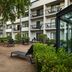 Courtyard by Marriott Kansas City Overland Park/Metcalf outdoor courtyard with lounge chairs and trees in Overland Park