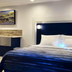 Retreat At Crystal Manatee guest room with queen bed and wall lights in Crystal River