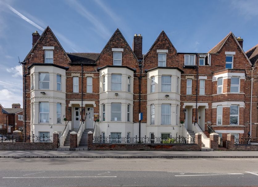 The Sportsview Guest House in Oxford, brick Victorian-style guest house exterior on a street
