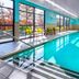 Towneplace Suites By Marriott Wrentham Plainville indoor pool with bright windows and seating in Wrentham