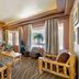Best Western East Zion Thunderbird Lodge in Mount Carmel lobby with rustic bamboo seating and large windows