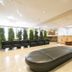 Urban Hotel Kyoto lobby with black seating, front desk, and tall windows in Kyoto