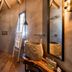 Anthemion Suites & Villas in Náfplio bathroom with wood ceiling, stone sink, and walk-in shower