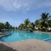Gem Beach Resort in Kuala Terengganu with a palm-lined outdoor pool and ocean view