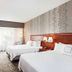 Courtyard by Marriott Knoxville Airport Alcoa room with two beds, desk, and large window in Alcoa