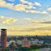 Boma Inn Nairobi overlooking Nairobi skyline at sunset with city buildings and cloudy sky