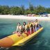 Guests ride a banana boat at Margaritaville Beach Resort Grand Cayman in George Town