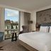 DoubleTree by Hilton Hull guest room with king bed, city view, and desk by large window