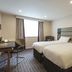 Premier Inn Aberdeen City Centre room with two beds, desk and window in Aberdeen