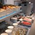 Breakfast buffet at B&B Hotel Figueres in Figueres with bread, fruit, and cereal on display