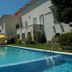 Pool and sun loungers at Roses Village Bed And Breakfast in Porto