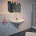 Salzufler Hof Bad Salzuflen bathroom with sink, mirror, shower stall and bathtub