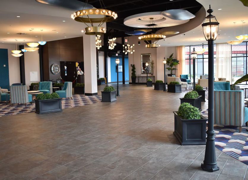 Fun City Resort Hotel Burlington lobby with seating area, lantern-style lights, and patterned carpet