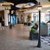 Fun City Resort Hotel Burlington lobby with seating area, lantern-style lights, and patterned carpet