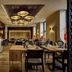 Cascada Boutique Hotel Lucerne restaurant dining room with set tables and warm ceiling lights