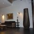 Hôtel En Ville in Aix-en-Provence lobby with sofa, coffee table and tall decorative vase