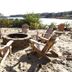 The Cove at Yarmouth by Westgate Resorts in West Yarmouth: beach fire pit with Adirondack chairs by the water