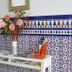 Hotel Doña Lina in Seville: floral arrangement on a white table against colorful tiled wall