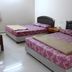 Skudai Baru Hotel in Skudai guest room with two double beds and simple bedside table