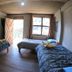 Salkantay Hostel Chaullay in Santa Teresa guest room with two beds and balcony door