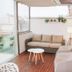 Casas e Quintas de Praia Aveiro balcony with sofa, table, chairs and glass door