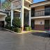 Motel 6 - Laurel, MS exterior with covered entrance, two-story guest rooms, and parking lot in Laurel