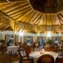 Ocean Beach Resort & Spa, Malindi: circular thatched dining room with round tables and chairs