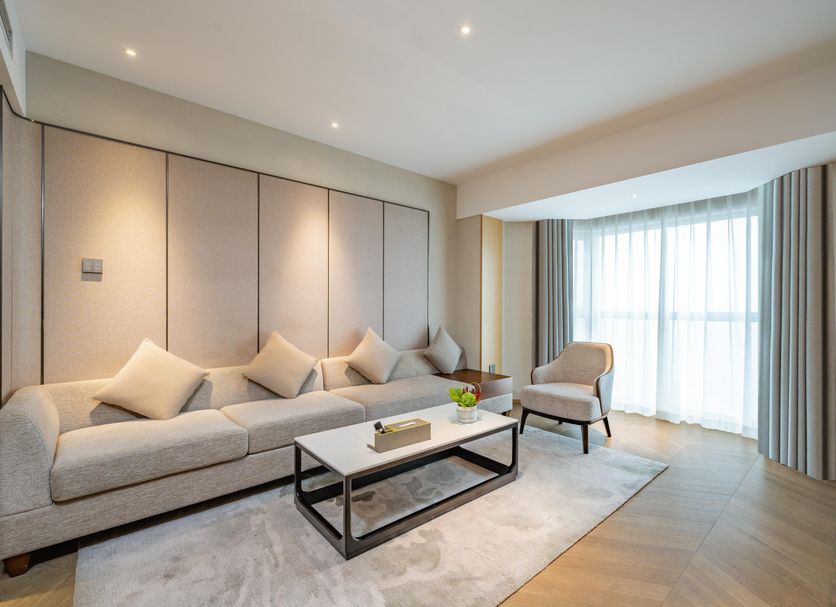 Holiday Inn Shanghai Huaxia by IHG suite with sofa, coffee table and floor-to-ceiling window in Shanghai